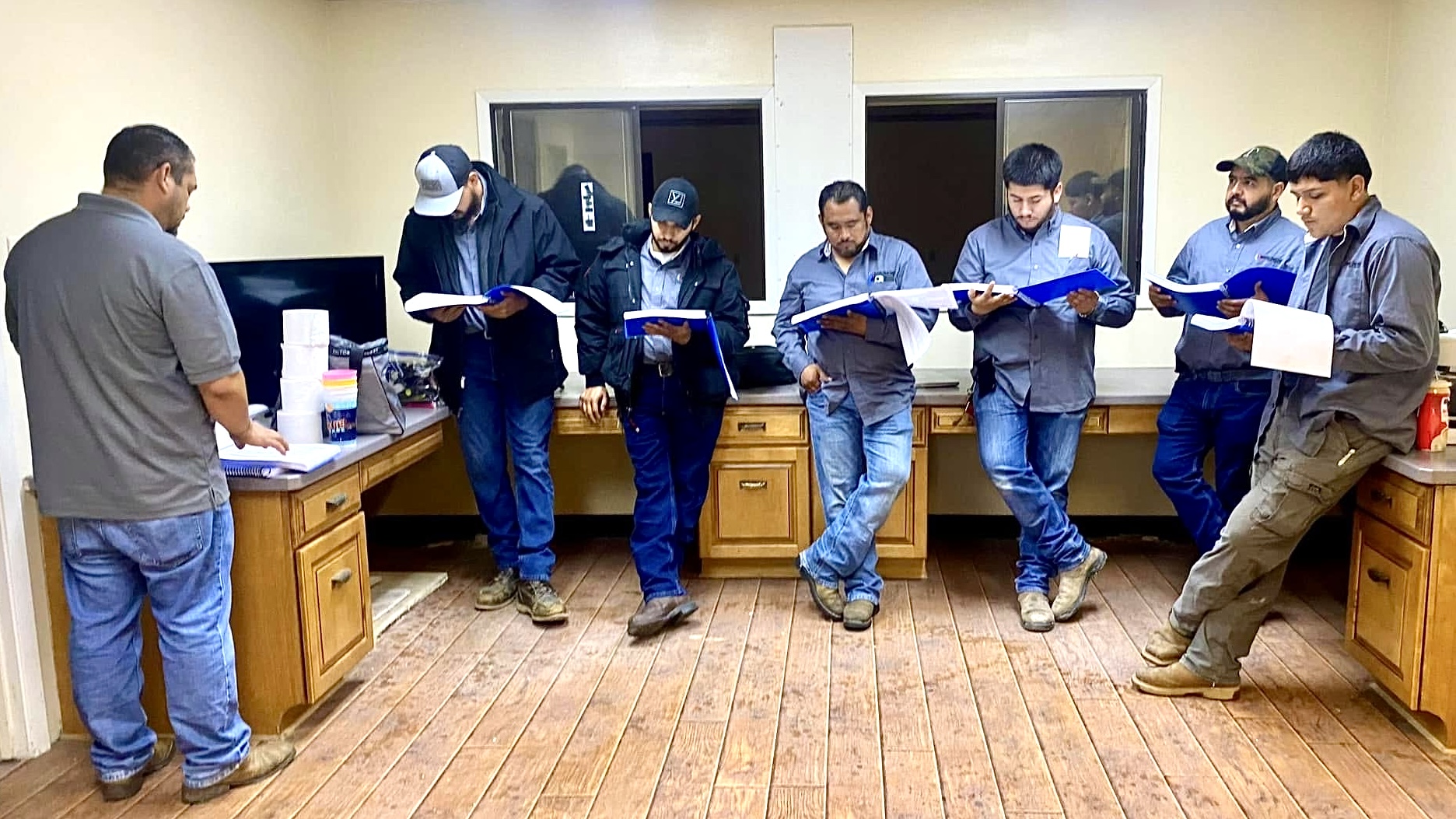 Technicians reviewing manuals